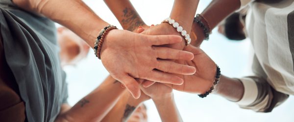 Support, community and teamwork with hands of friends from bottom for goals, vision or networking together. Motivation, collaboration and growth with circle of people for mindset, mission or contact.