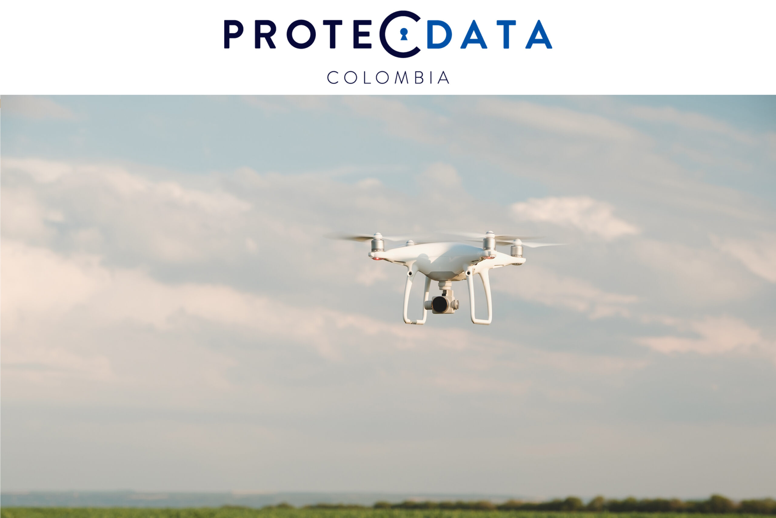 white-drone-hovering-in-bright-blue-sky